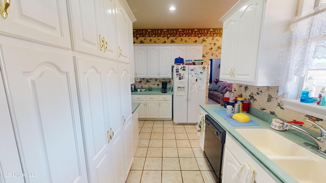 kitchen with dishwasher, white fridge with ice dispenser, sink, light tile patterned floors, and white cabinetry