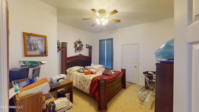 bedroom with ceiling fan and light carpet