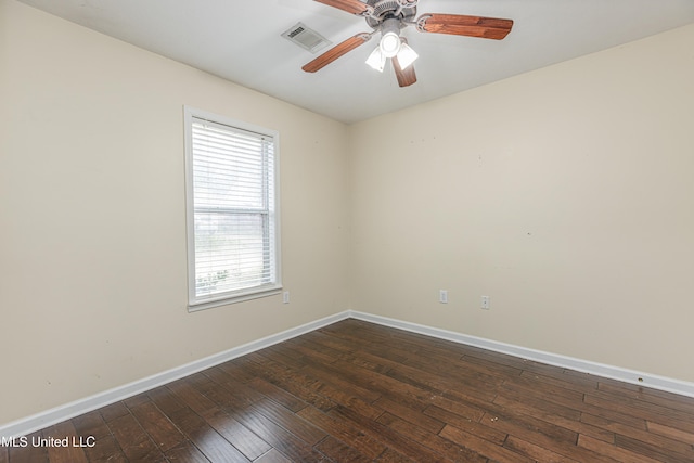 spare room featuring ceiling fan and dark hardwood / wood-style flooring