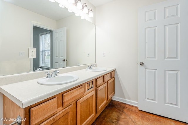 bathroom with tile patterned floors and vanity