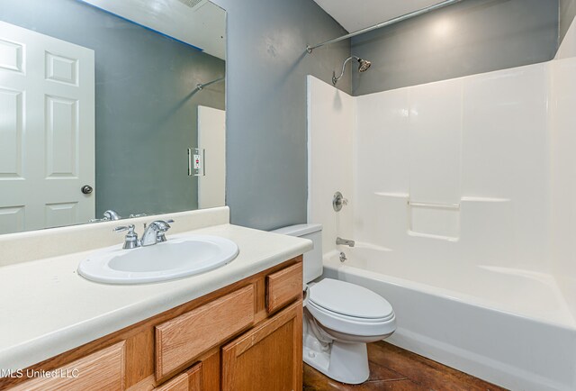 full bathroom featuring tile patterned flooring, vanity, toilet, and shower / tub combination