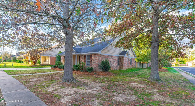 159 Basswood Cir, Brandon, MS 39047 - view of front of property featuring brick siding and a front lawn