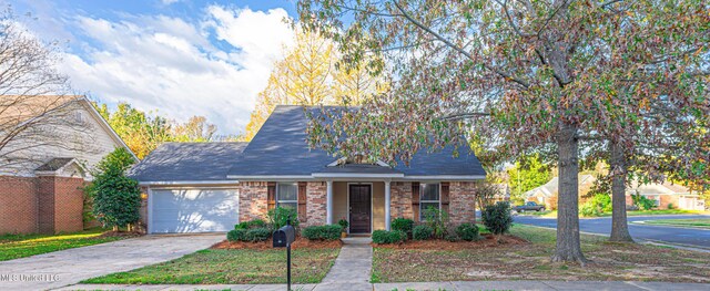 159 Basswood Cir, Brandon, MS 39047 - view of front of property with a garage, concrete driveway, and brick siding