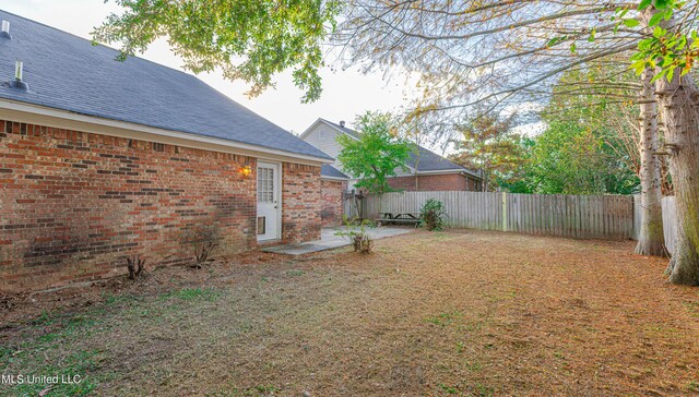 159 Basswood Cir, Brandon, MS 39047 - fenced backyard with a patio area