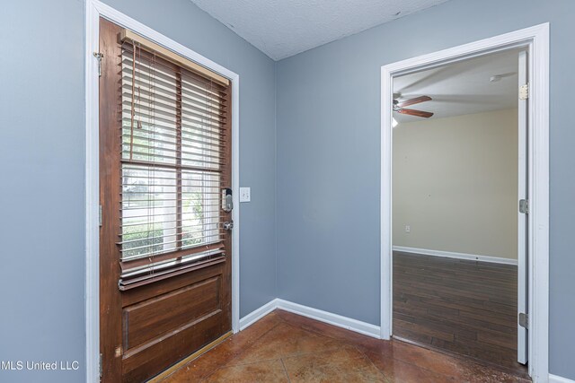 159 Basswood Cir, Brandon, MS 39047 - doorway to outside with a ceiling fan, tile patterned flooring, and a textured ceiling