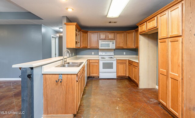 159 Basswood Cir, Brandon, MS 39047 - kitchen with white appliances, a peninsula, light countertops, and glass insert cabinets