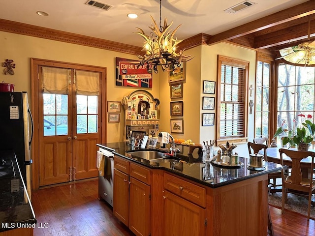 48 Fairway Dr, Natchez, MS 39120 - kitchen with sink, dark stone countertops, dark hardwood / wood-style flooring, stainless steel appliances, and a center island with sink