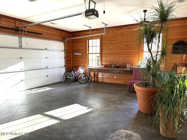 48 Fairway Dr, Natchez, MS 39120 - garage with a garage door opener and wooden walls