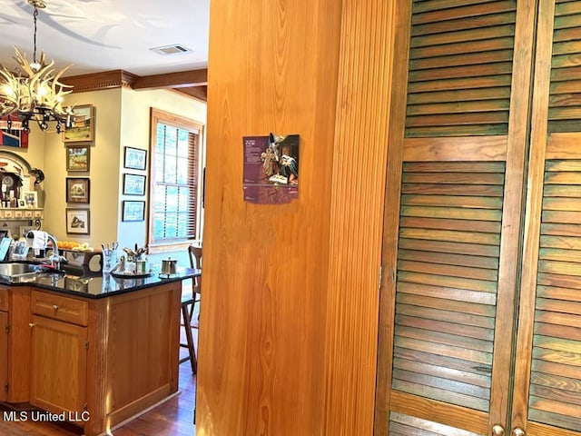 48 Fairway Dr, Natchez, MS 39120 - interior details featuring hardwood / wood-style flooring, sink, and a notable chandelier