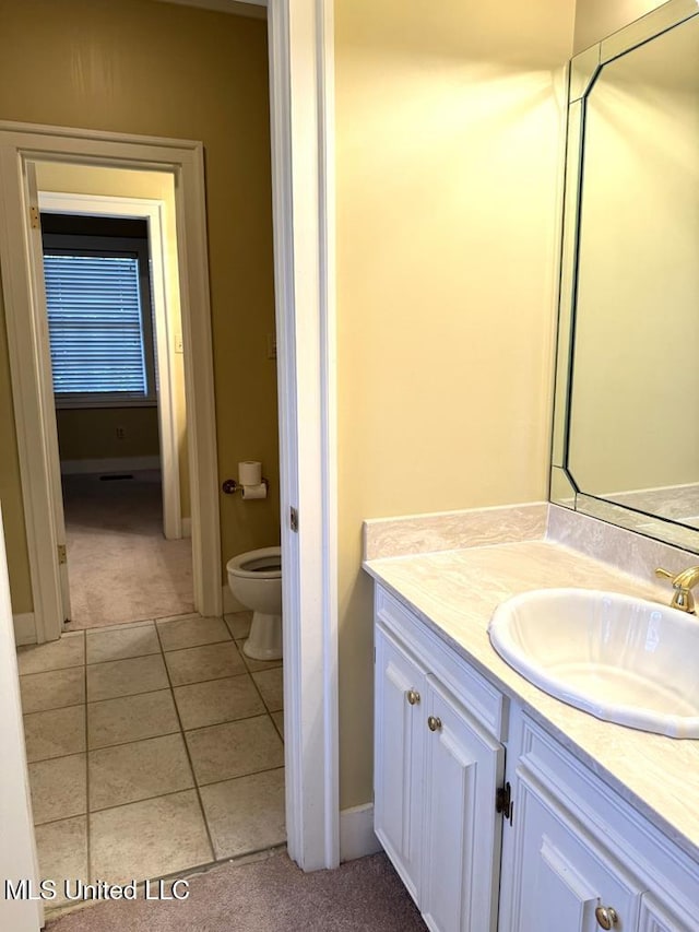 48 Fairway Dr, Natchez, MS 39120 - bathroom with vanity, tile patterned floors, and toilet