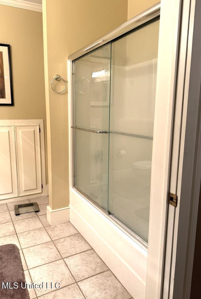 48 Fairway Dr, Natchez, MS 39120 - bathroom featuring crown molding, tile patterned floors, and combined bath / shower with glass door
