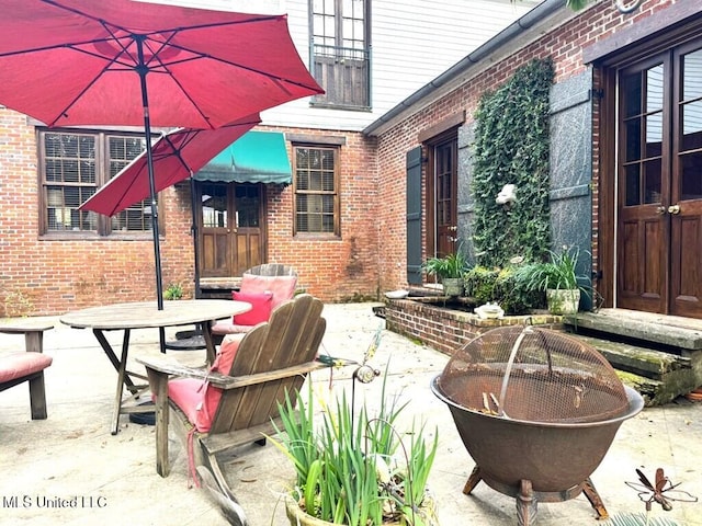 48 Fairway Dr, Natchez, MS 39120 - view of patio with an outdoor fire pit