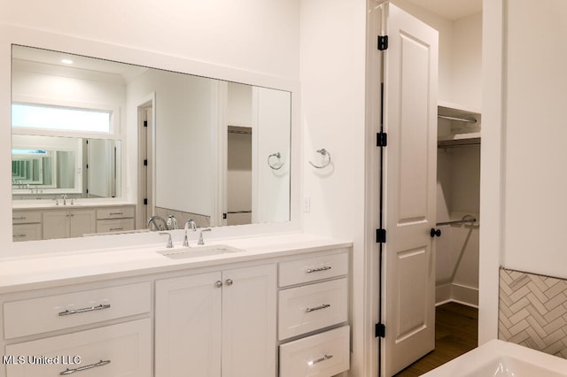 bathroom featuring vanity and hardwood / wood-style flooring