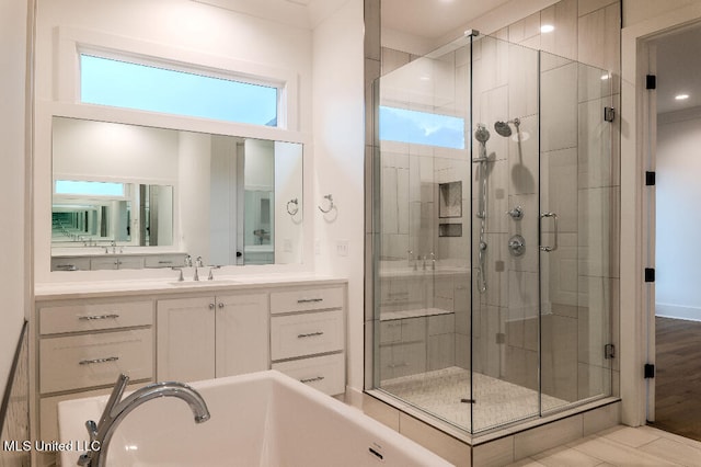 bathroom with vanity, shower with separate bathtub, and hardwood / wood-style flooring