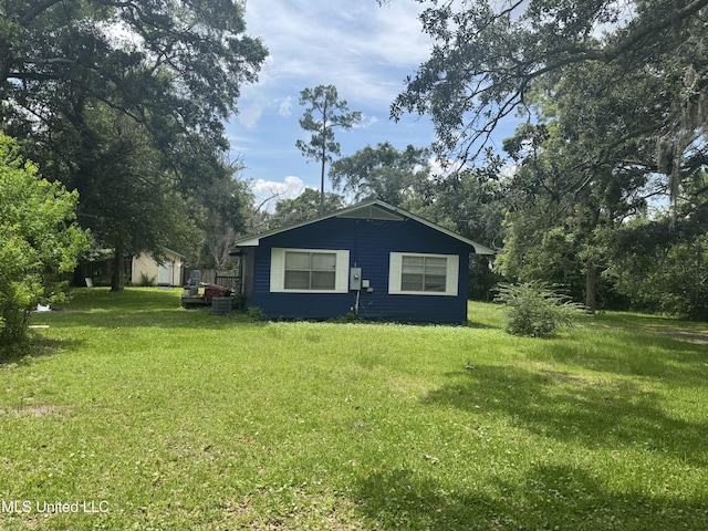 5418 Elder St, Moss Point, MS 39563 - view of side of home with a lawn