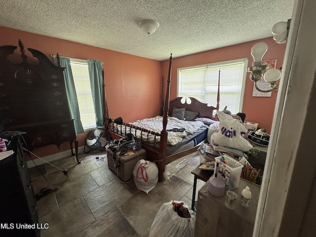 5418 Elder St, Moss Point, MS 39563 - bedroom featuring a textured ceiling