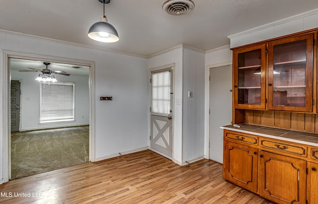 204 Turtle Creek Dr, Brandon, MS 39047 - unfurnished dining area featuring light wood-style flooring, crown molding, baseboards, and ceiling fan