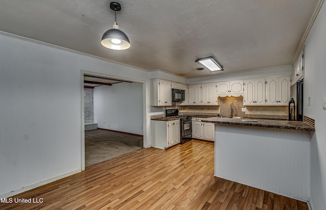 204 Turtle Creek Dr, Brandon, MS 39047 - kitchen featuring black appliances, dark countertops, light wood-type flooring, white cabinetry, and baseboards