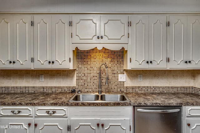 204 Turtle Creek Dr, Brandon, MS 39047 - kitchen with stainless steel dishwasher, a sink, dark countertops, and white cabinets