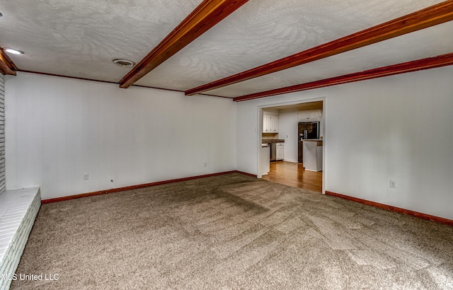 204 Turtle Creek Dr, Brandon, MS 39047 - unfurnished room featuring a textured ceiling, carpet, baseboards, and beam ceiling