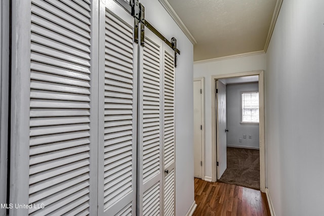 204 Turtle Creek Dr, Brandon, MS 39047 - hall featuring ornamental molding, wood finished floors, baseboards, a heating unit, and a barn door