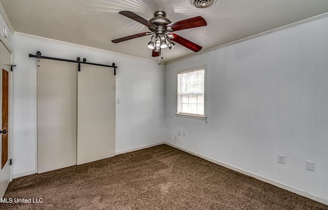 204 Turtle Creek Dr, Brandon, MS 39047 - empty room with a barn door, ornamental molding, a ceiling fan, and carpet