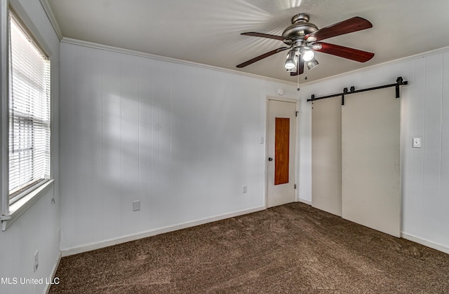 204 Turtle Creek Dr, Brandon, MS 39047 - carpeted spare room featuring a barn door, a ceiling fan, and ornamental molding