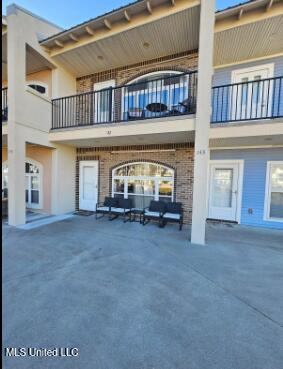 rear view of property with a patio area