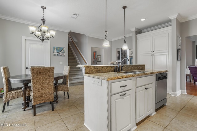 kitchen featuring white cabinetry, stainless steel dishwasher, sink, and a center island with sink