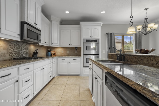 kitchen featuring white cabinetry, light tile patterned floors, and appliances with stainless steel finishes