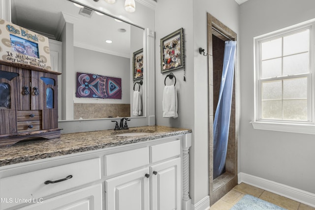 bathroom with vanity, ornamental molding, curtained shower, and tile patterned floors