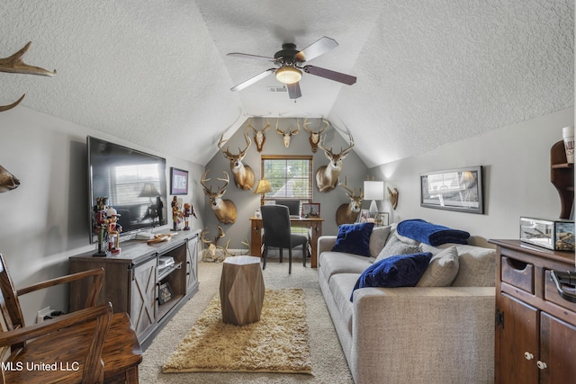 carpeted living room featuring ceiling fan, vaulted ceiling, and a textured ceiling