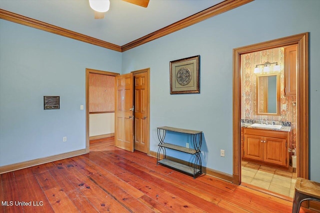 bedroom with sink, ensuite bath, ceiling fan, ornamental molding, and light hardwood / wood-style floors