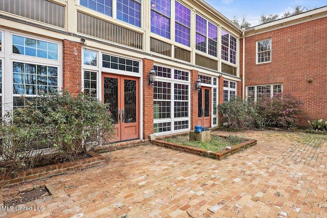 entrance to property featuring a patio