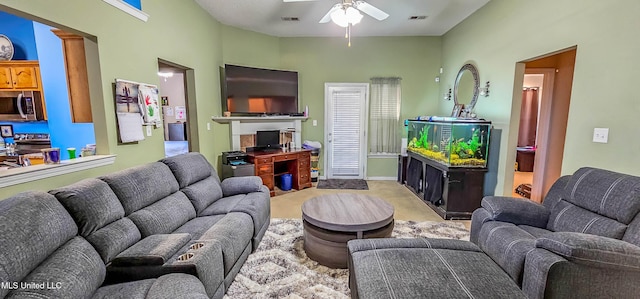 living room featuring light carpet and ceiling fan