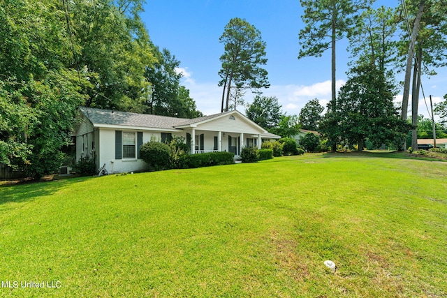 view of front of property with a porch and a front lawn