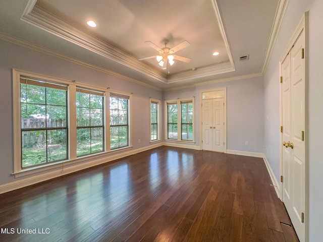 796 Hapuna Pl, Diamondhead, MS 39525 - unfurnished room with a raised ceiling, ceiling fan, dark wood-style flooring, baseboards, and ornamental molding