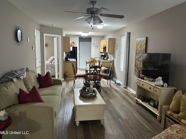 15501 Quail Creek Cv, Diberville, MS 39540 - living room featuring a ceiling fan, dark wood-style flooring, and baseboards