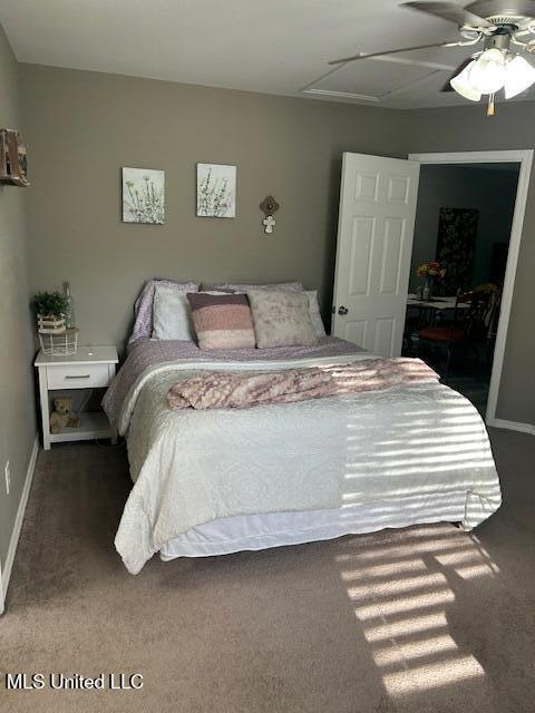 15501 Quail Creek Cv, Diberville, MS 39540 - bedroom with carpet floors, ceiling fan, and baseboards