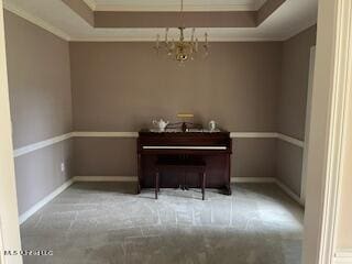 misc room featuring light carpet, ornamental molding, and an inviting chandelier