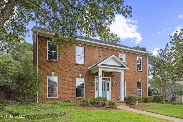 1034 Northpointe Dr, Jackson, MS 39211 - view of front of home with brick siding and a front yard