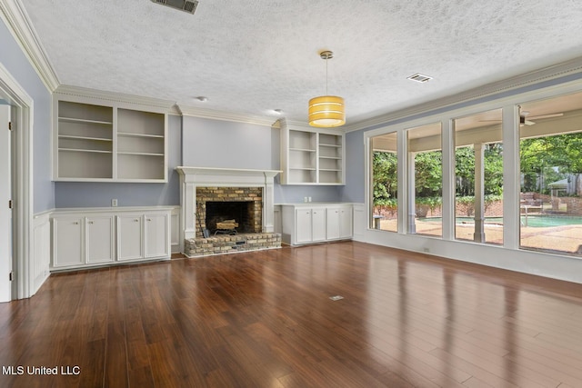 1034 Northpointe Dr, Jackson, MS 39211 - unfurnished living room featuring a textured ceiling, ornamental molding, dark wood-type flooring, and a fireplace