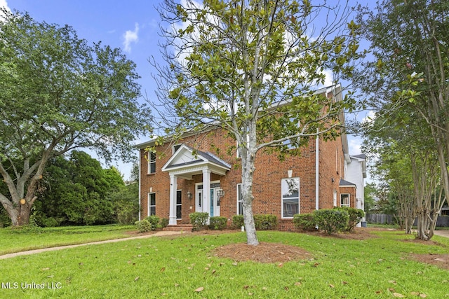 1034 Northpointe Dr, Jackson, MS 39211 - greek revival inspired property featuring brick siding and a front yard
