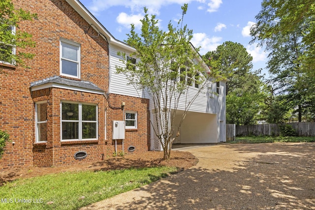 1034 Northpointe Dr, Jackson, MS 39211 - view of side of home with driveway and brick siding