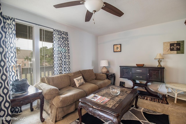 living room featuring a ceiling fan and light colored carpet