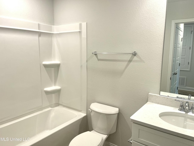 full bathroom with shower / tub combination, vanity, and toilet