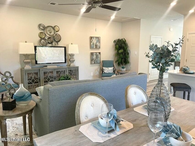 dining space featuring hardwood / wood-style floors and ceiling fan