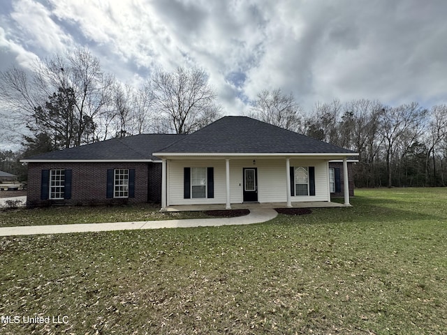 ranch-style house with a porch and a front lawn