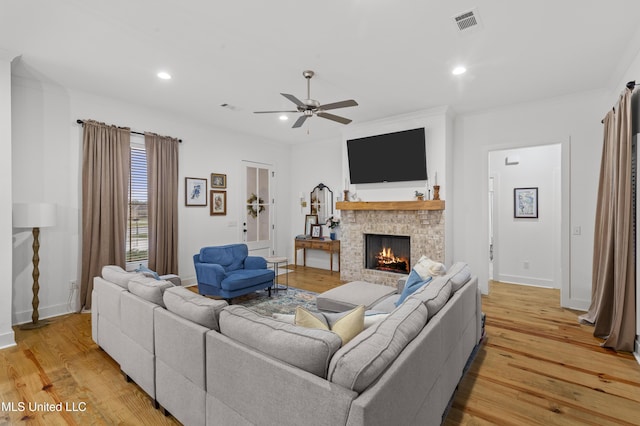 970 Glenwild Cir, Canton, MS 39046 - living area with light wood-style floors, a ceiling fan, a brick fireplace, recessed lighting, and ornamental molding