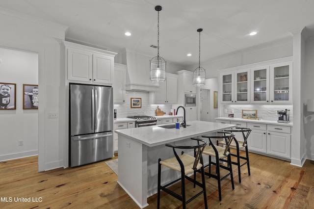 970 Glenwild Cir, Canton, MS 39046 - kitchen featuring stainless steel appliances, a sink, tasteful backsplash, white cabinets, and recessed lighting